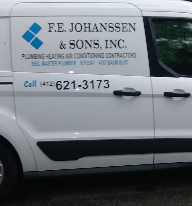 Close view of the door of a white F.E. Johanssen & Sons van, showing the blue diamond mark, the company name, 4767 Baum Blvd and the phone number.